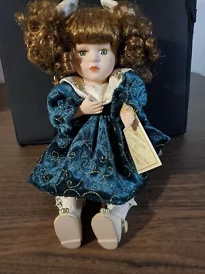 Vintage Wind Up Porcelain Doll Sitting With MovementMusic And COA • $38