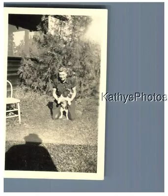 Found B&w Photo H_5327 Woman Kneeling In Back Yard Holding Her Dog Man's Shadow • $6.98