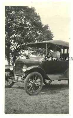 Found B&w Photo H_1975 Man Sitting In Car In Front Of Tree Ore Plate • $6.98