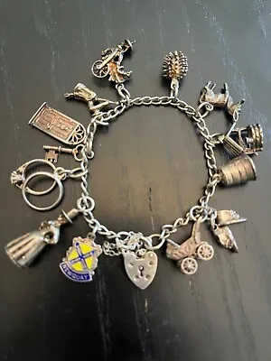 Vintage English Sterling Silver 12 Charm Bracelet Moving Heart Clasp  • $94