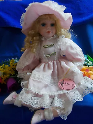 LOVELY PORCELAIN DOLL   ALICE   HOMEART 5355 - SITTING ON STAND 31 Cm GC # 22 • $35