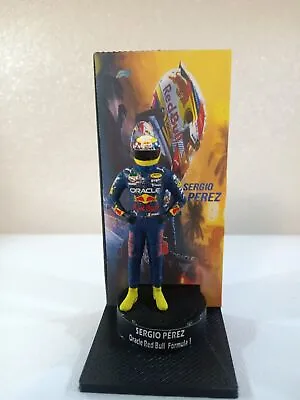 Figure 1/43 Sergio Pérez Oracle Red Bull + Podium Formula 1 • $54.68