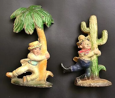 Cast Iron Bottle Openers TWO  Drunk Cowboy On Cactus  &  Drunk Tourist On Palm  • $52