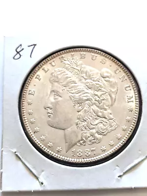 1887 Morgan Silver Dollar In BU Condition Lots Of Silver Luster Toning On Back • $45