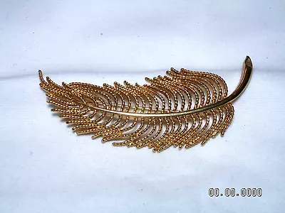 ...Vintage MONET...Gold Tone Feather Brooch... • $12