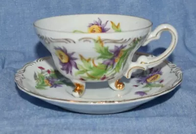 Vintage 3-Footed Tea Cup And Saucer Purple & Yellow Flowers On White W/ Gold • $9.09