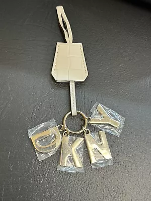 Brand New NEW STYLE DKNY DONNA KAREN Golden Bag Charm W/ White Faux Leather. • $11.99