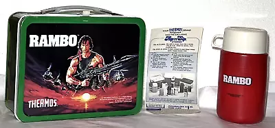 VINTAGE RAMBO 1985 LUNCHBOX AND THERMOS - UNUSED W/ PAPER INSERT • $109