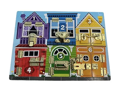 Melissa & Doug Latch And Lock Wooden Puzzle Board  • $8