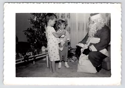 C1940s-50s MCM Christmas~Santa Giving Out Presents~Siblings~Vintage B&W Photo • $9.95