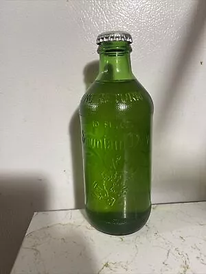 Full 10 Oz. Embossed Hillbilly Mountain Dew Green Soda Bottle Throw Away Bottle • $14.99