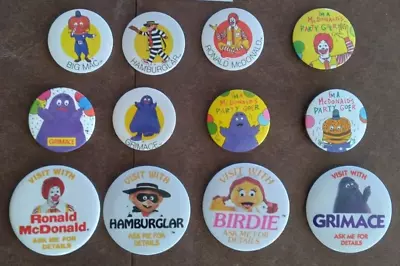 VISIT WITH - 12 DIFFERENT VINTAGE McDONALDLAND EMPLOYEE CREW PIN BACK BUTTONS • $20