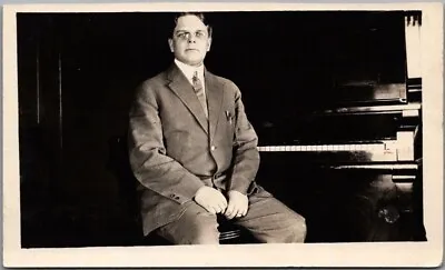 Vintage 1910s RPPC Real Photo Postcard Young Man In Suit & Round Glasses / Piano • $4