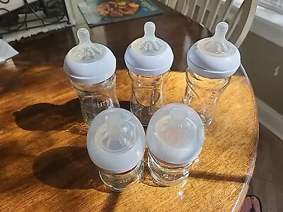 Lot Of 5 Advent Glass Baby Bottles With Nipples + 2 Covers   • $25.50