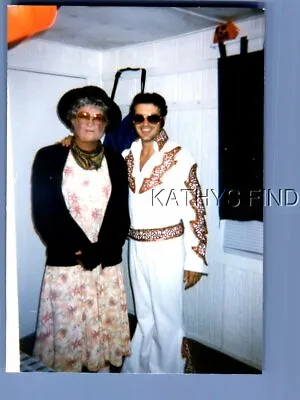 Found Color Photo H+1728 Elvis Impersonator Posed With Woman In Dress And Glasse • $6.98