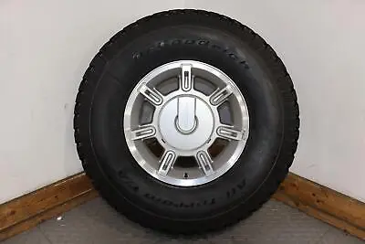 03-07 Hummer H2 (1) 17x8.5 OEM 7 Spoke Wheel W/ BFG A/T Tire & Cap Has Curb Rash • $348