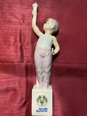 Lladro #7513 Special Olympics Boy Holding Torch - 1991 • $39.95