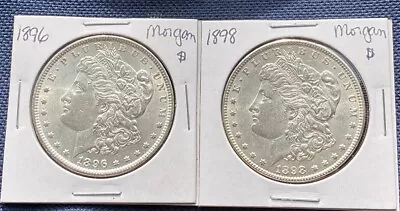 A Pair Of Morgan Silver Dollars.A 1896 And 1898 Philadelphia Minted. • $64.21