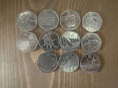 JOB LOT OF 11 DIFFERENT OLYMPIC 50Ps (INCLUDING WRESTLING) • £26