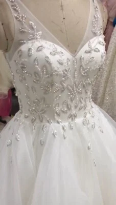 $780 • Buy A-Line Ivory V-Neck Wedding Dress With Organza Ruffles And Corset Back