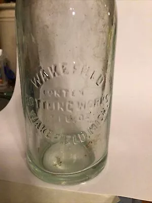 Embossed Soda Bottle Wakefield Bottling Works Michigan Mi Mich. 1918 • $7.88