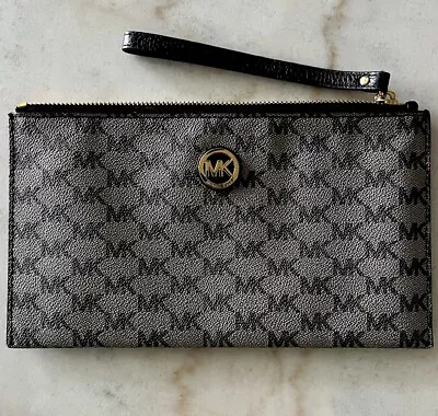 Michael Kors Jet Set Large Black And Silver Wristlet. • $20