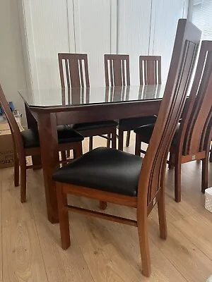 $600 • Buy Large 8 Seater Timber And Glass Dining Table And Chairs