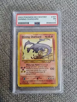 PSA 1 Shining Charizard - 107/105 Neo Destiny 2002 - Holographic Pokemon Card  • $1000