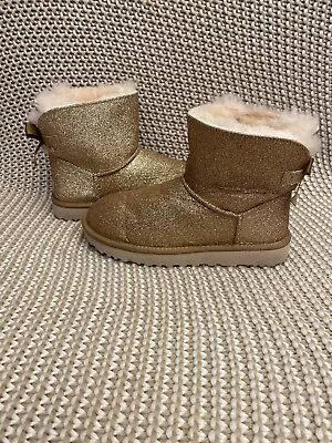 UGG Women's Mini Bailey Bow Sparkle Sheepskin Boots Gold Size 7 • $80