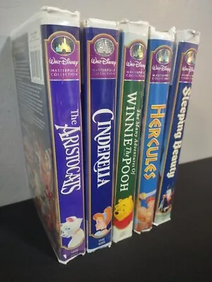 Lot (5) Vintage Walt Disney Masterpiece Collection VHS Clamshell Tapes Untested • $15.48