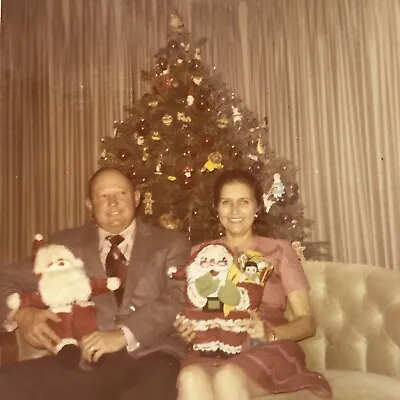 Vintage Color Photo Man Woman Sitting On Couch Holding Santa Claus Christmas • $6.69