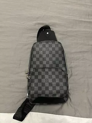 Louis Vuitton Black Sling Bag • $400