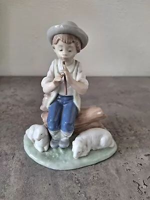 NAO FIGURINE   Shepherd Boy On Log Playing A Whistle With 2 Lambs  • £29.95