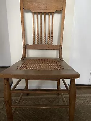 Antique Wooden Spindle Carved Back Chair With Cane Seat. • $109