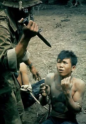 Vietnam War Photo  /  US Soldier Threatens Vietnamese Prisoner  COLOR Photo 8321 • $6.99