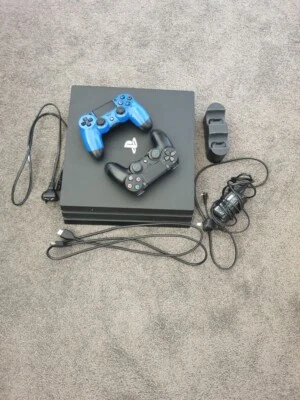 $200 • Buy Sony PlayStation 4 Pro 1TB, Two Controllers And Wireless Charging Stand