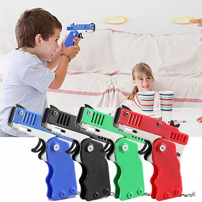 Mini Rubber Band Gun Toy Metal With Key Chain Elastic Safe For Kid Outdoor Party • £3.79
