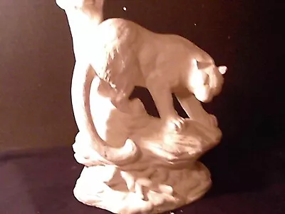 A Statue Of A Mountain Lion Perched On A Rock • $50