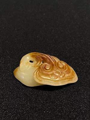 Ming， White And Russet Jade Carved “LingZhi” Pendant/明，白玉沁色灵芝挂件（全品） • $2500
