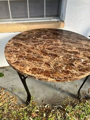 Brown/White Granite Outside Table With Brass Legs. • $100