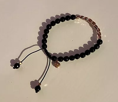 Lola Rose Black And Gold Bracelet • £20