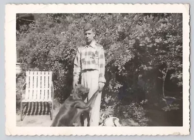 1950s Vintage Found Photo Young Man & Faithful Labrador Retriever Holding Hands • $8.50