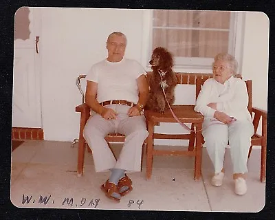 Vintage Photograph Adorable Black Puppy Dog Sitting Between Man & Woman On Porch • $7