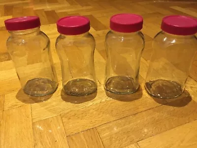 4 Large Matching Glass Storage Jars With Lids • $15