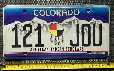 2000s COLORADO License Plate # 121 JOU  AMERICAN INDIAN SCHOLARS • $12