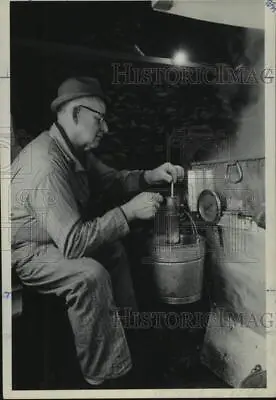 Press Photo Man Tests Maple Syrup With Hydrometer In New York - Tua30641 • $19.99