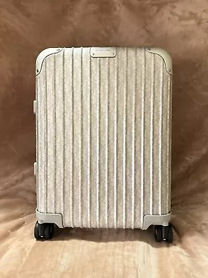 DIOR AND RIMOWA Carry-On Luggage • $7000