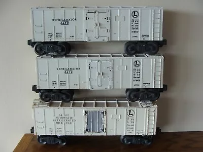 3 Lionel (1)-Glossy White Milk Car No. 3462 And (2)-Refrigerator Cars No. 6472 • $35