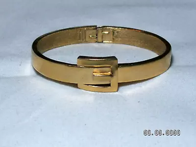 ...Vintage Crown TRIFARI...Gold Tone Buckle Design Hinged Clamper Bracelet... • $18