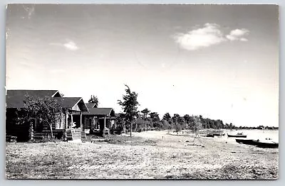 Lake City Michigan~Bruske Cottages~Log Cabins On Waterfront~1954 RPPC • $14